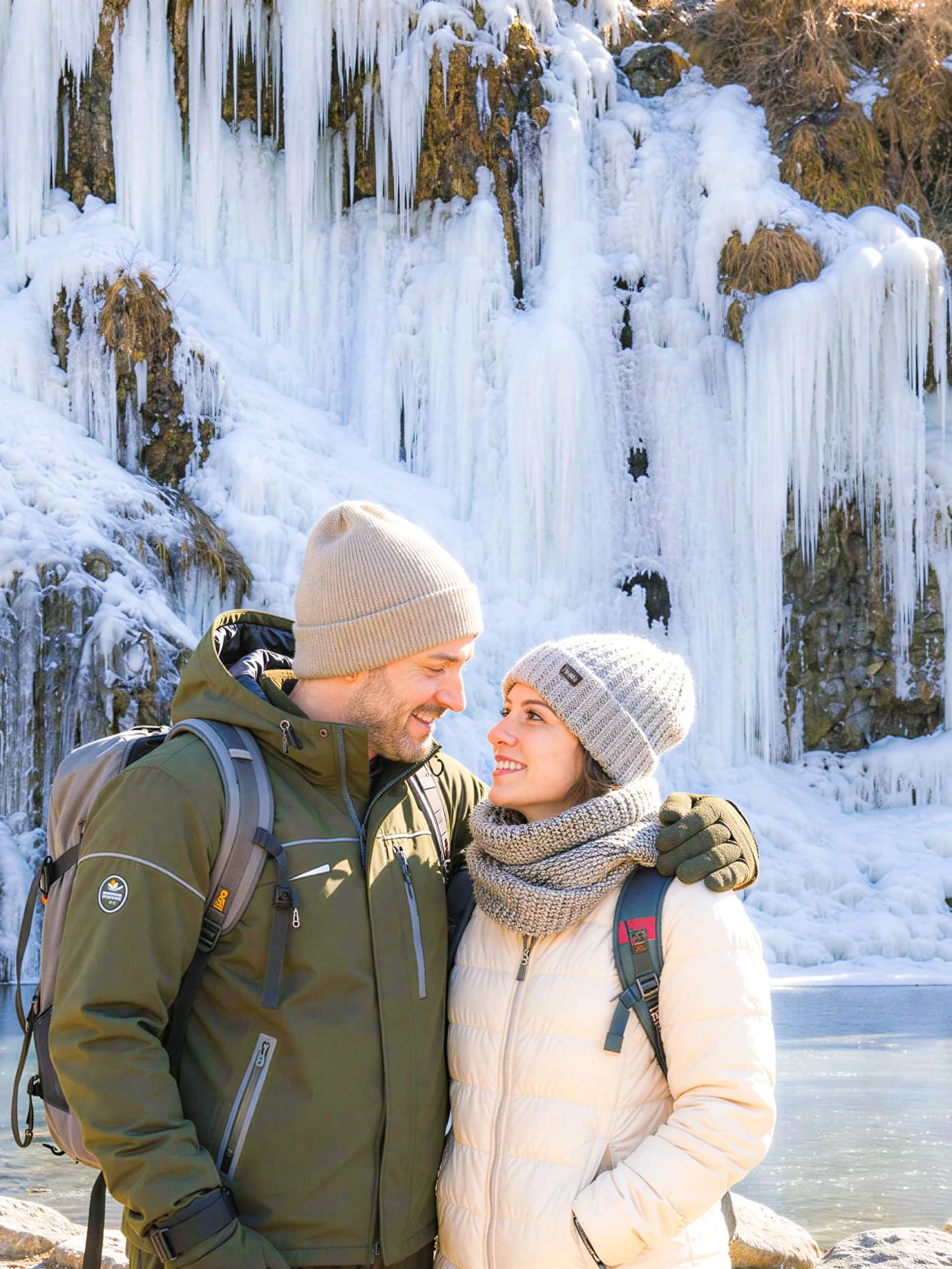 A couple standing in front of a frozen waterfall — Pocheon tour